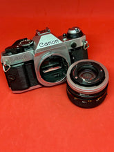 Load image into Gallery viewer, Canon AE-1 Program 35mm Camera with 50mm f/1.4 S.S.C. Lens