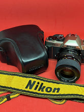 Load image into Gallery viewer, Nikon FM10 Outfit with Nikkor 35-70mm f/3.5-4.8 Zoom Lens