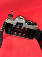 Load image into Gallery viewer, Nikon FM10 Outfit with Nikkor 35-70mm f/3.5-4.8 Zoom Lens