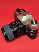 Load image into Gallery viewer, Nikon FM10 Outfit with Nikkor 35-70mm f/3.5-4.8 Zoom Lens