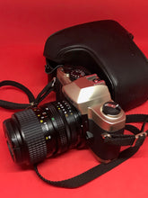 将图片加载到图库查看器，Nikon FM10 Outfit with Nikkor 35-70mm f/3.5-4.8 Zoom Lens